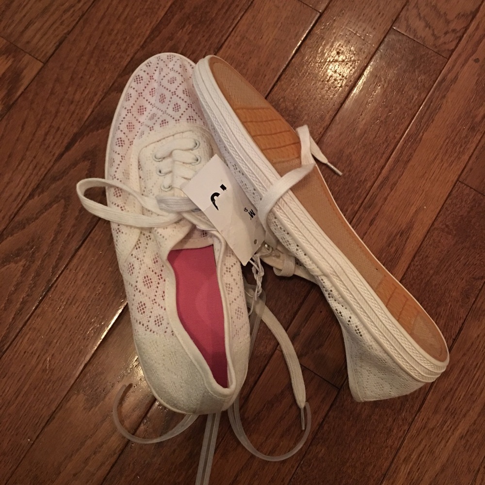 Soft comfy flat sneaker looking shoe.